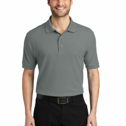 A middle aged man is wearing a grey polo shirt and black khakis. This polo shirt can be customized by custom custom clothing.