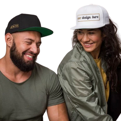 A young man and woman sit beside each other and are smiling while wearing custom flat brimmed caps. These custom caps are available at custom custom clothing.