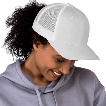 A close up head shot of young woman wearing a blank retro trucker hat. These custom hats are available at custom custom clothing.